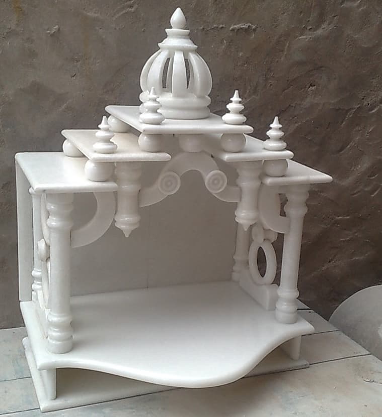 Design inspiration: compact white marble mandir with turned pillars and a carved dome