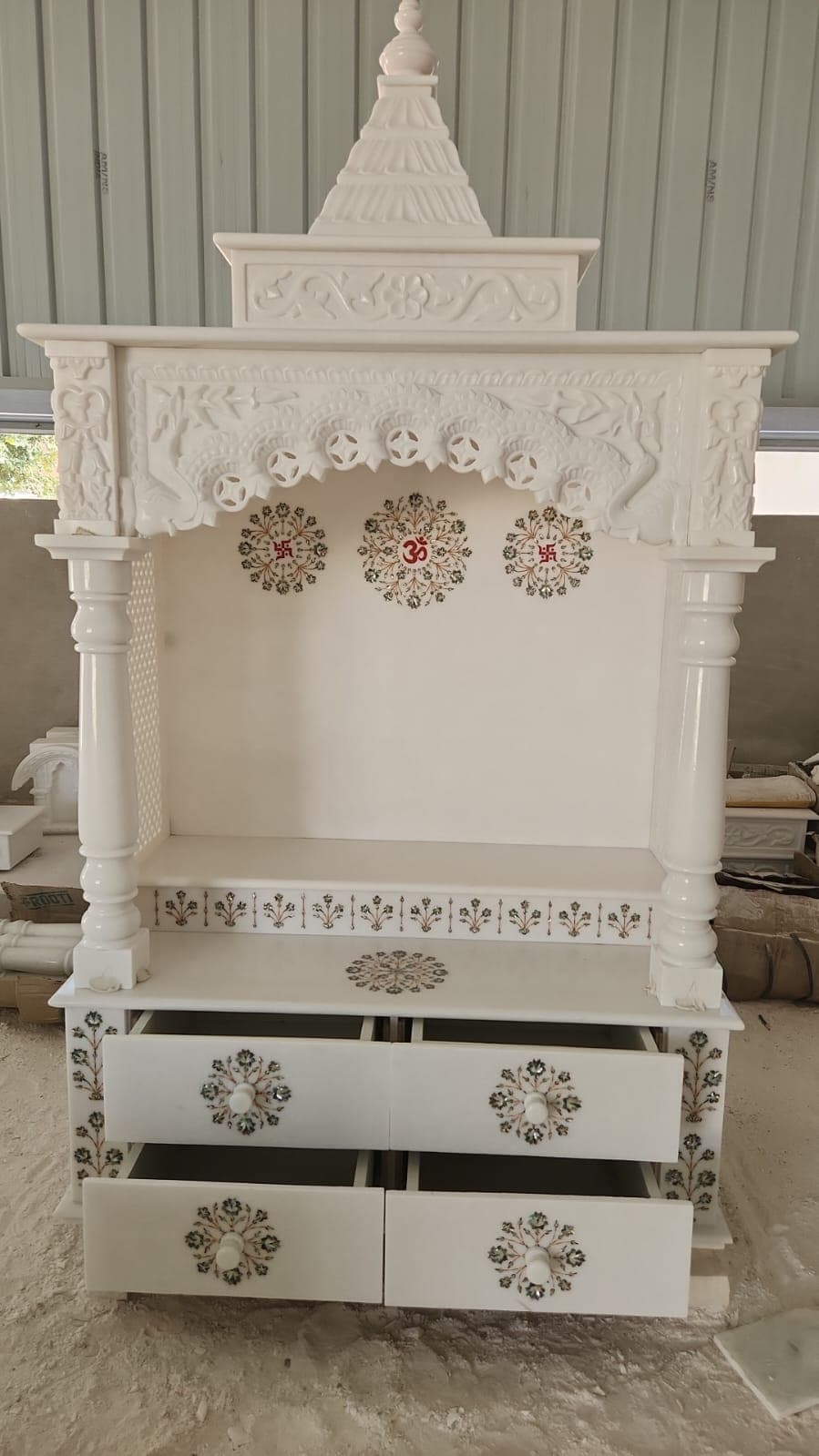 Design inspiration: white marble mandir with shikhar, carved arch, inlay motifs and storage drawers